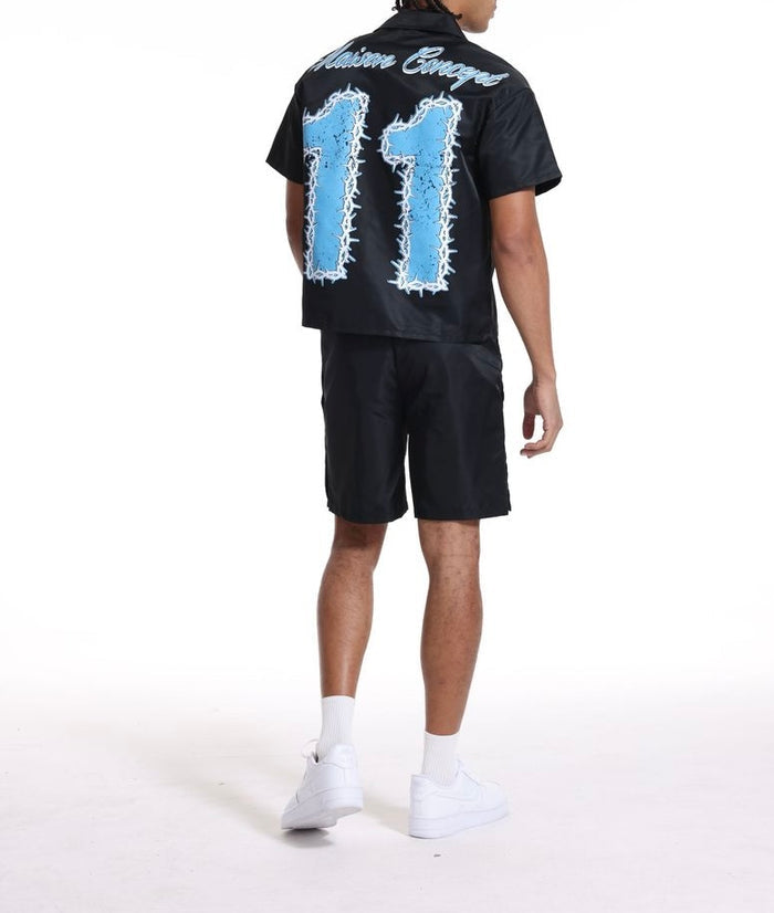 Black and blue Concept LA 'Concept 11' shorts laid flat, showcasing their design and fabric texture.