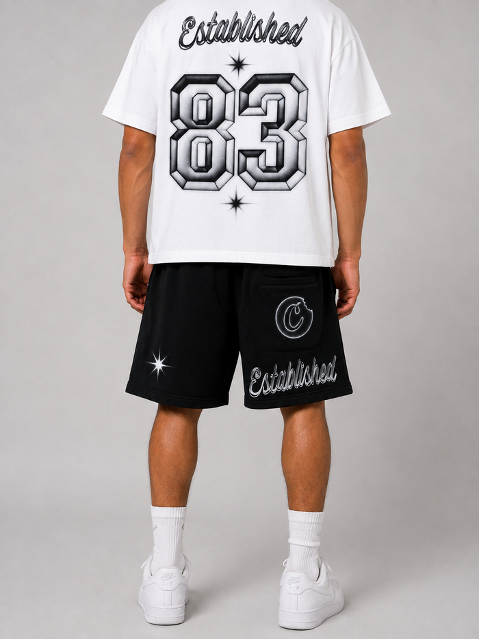 Cookies Draft Day SS Box Knit T-Shirt in white, styled on a model, showcasing a casual fit and logo detail.