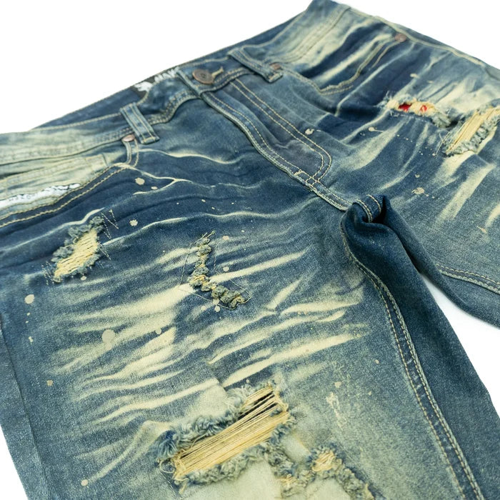 Makobi Modena denim jeans in dirt wash with classic five-pocket design and straight-leg fit, displayed on a neutral background.