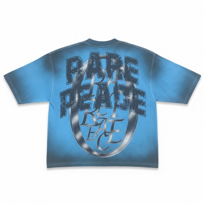 Blue oversized rhinestone T-shirt by Rare Peace with "CHAOS" graphic, featuring a cropped fit and bold, eye-catching design.
