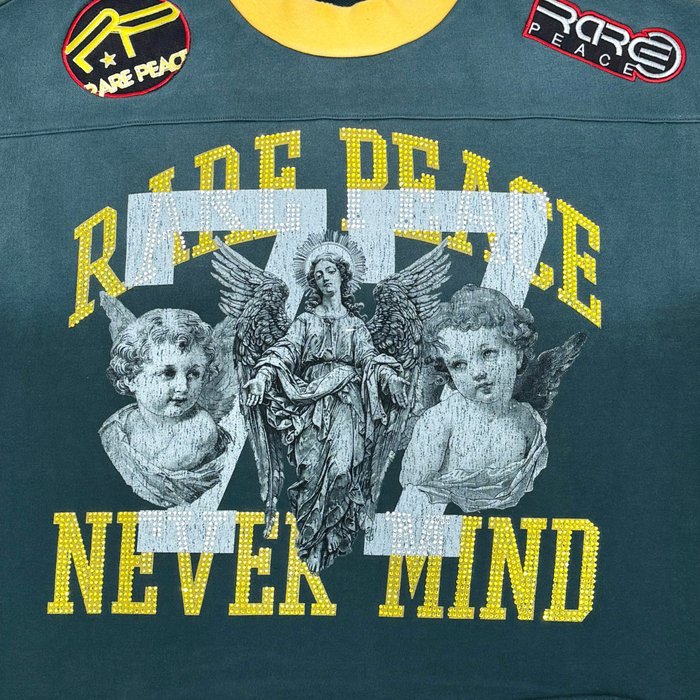 Pine green RARE PEACE oversized rhinestone cropped French terry T-shirt with "Never Mind" graphic and relaxed fit.