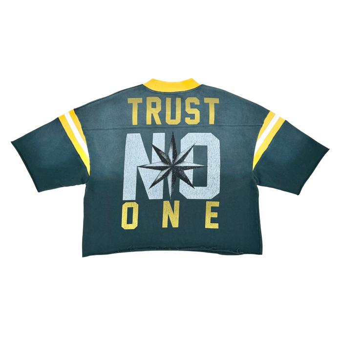 Rare Peace 'Never Mind' oversized rhinestone cropped French terry T-shirt in pine green, featuring bold graphic design.