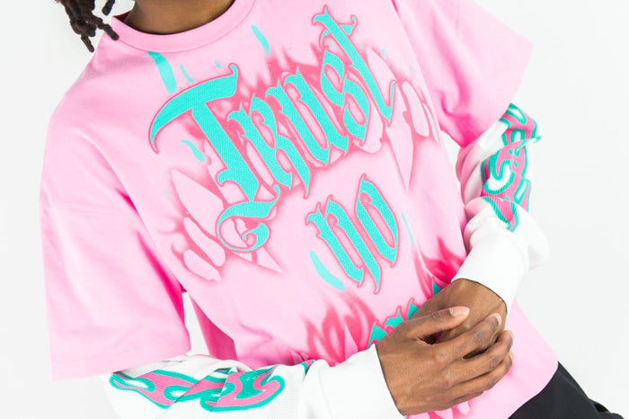 Pink Rebel Minds Trust No One long sleeve T-shirt with bold printed design on front, casual fit for everyday wear.