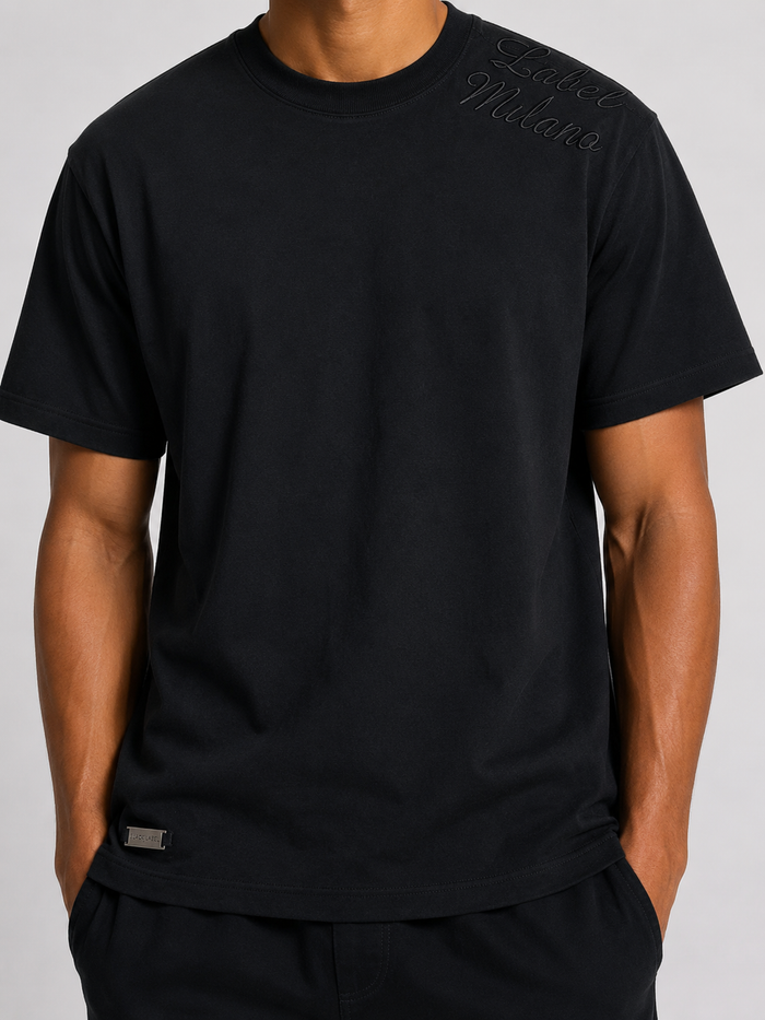 Black Label Milano premium black T-shirt, soft cotton tee with classic fit, displayed flat on a plain background.