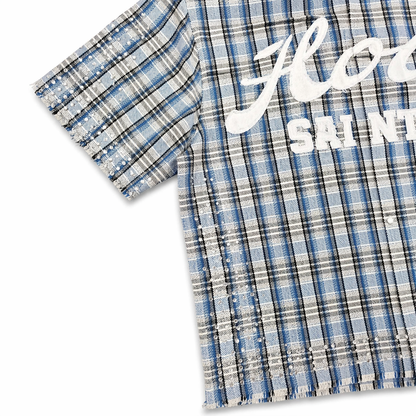 Copper Rivet Fray Holy Saint short sleeve shirt featuring blue stones and detailed design on the front.