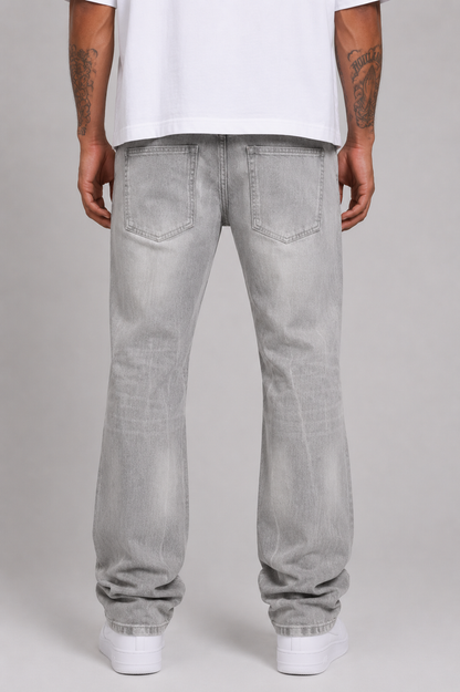 Evolution Relaxed Straight Grey Denim jeans, showing the front view with classic five-pocket design and subtle fading details.