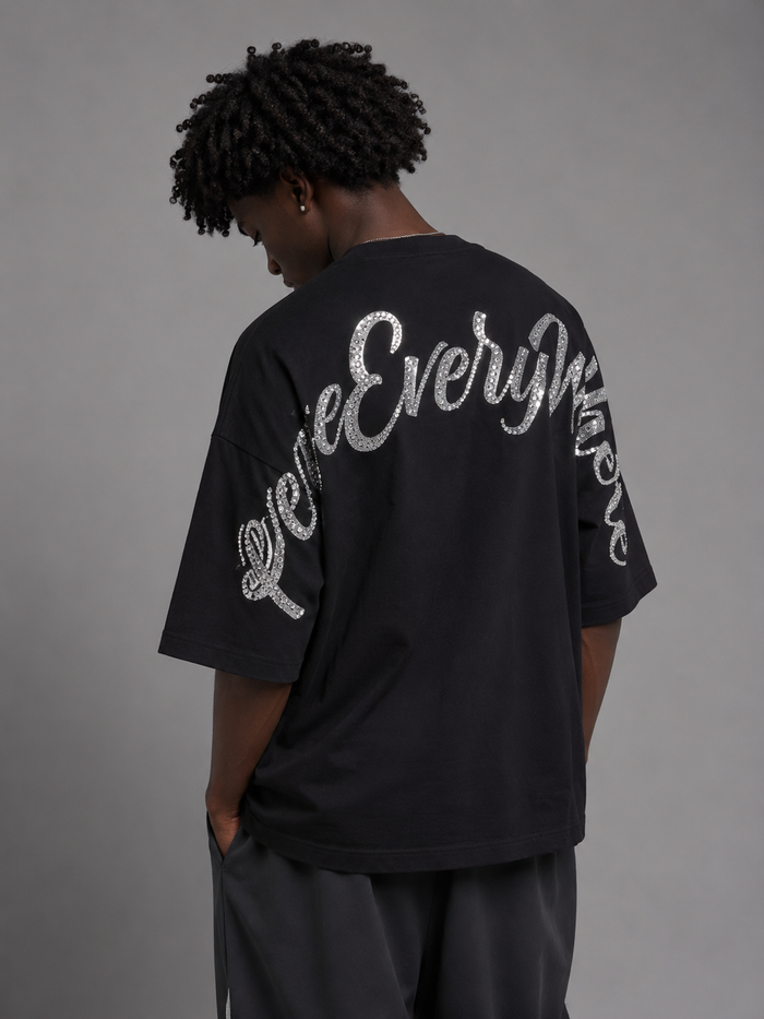 Black Inner Peace 'Peace Everywhere' oversized rhinestone T-shirt with bold peace graphic on front.