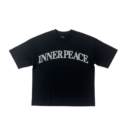 Black Inner Peace 'Peace Every Where' oversized rhinestone T-shirt with bold peace symbol design on front.