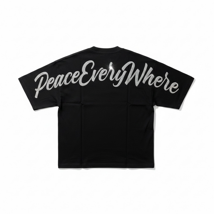 Inner Peace black oversized rhinestone T-shirt with "Peace Everywhere" design, showcasing bold, sparkling embellishments.