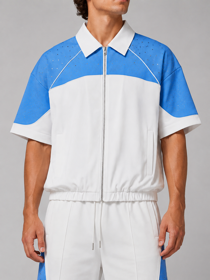 White and blue Kindred rhinestone nylon zip-up shirt with a front zipper and stylish design.
