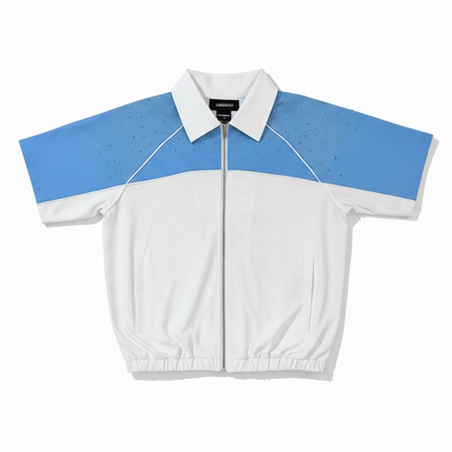 White and blue Kindred rhinestone nylon zip-up shirt, front view showing zipper and sparkling rhinestone details.