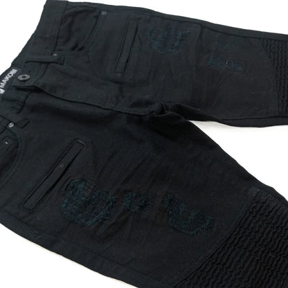 Makobi Kids Rick Biker black denim kids' jeans with distressed details and classic five-pocket design, shown on a child model.
