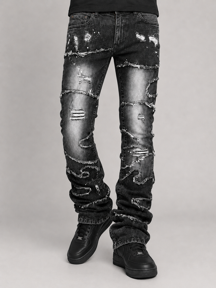 Makobi Pastoni stacked black wash denim jeans with layered design and branded details, casual and stylish for everyday wear.