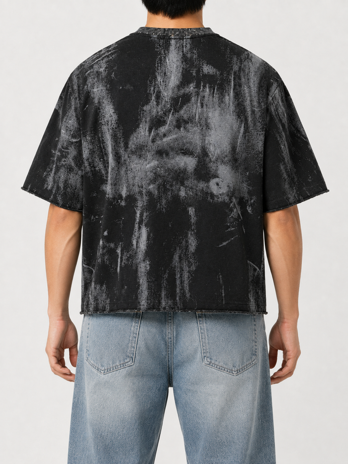 Men's black BKYS Disaster cropped rhinestone T-shirt with bold design, showcased on a model in Sacramento, California.