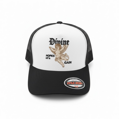 White and black MUKA Divine trucker hat with mesh back, adjustable snap closure, and embroidered logo on front.
