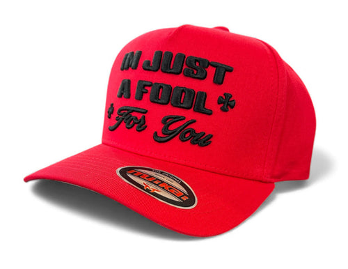 Red MUKA Fool For You snapback hat with flat brim and adjustable strap, featuring bold embroidered text.