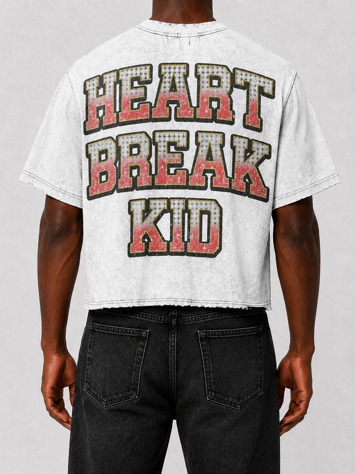 White Prestige Heart Break Kid cropped T-shirt featuring a graphic design, casual fit, and trendy style.