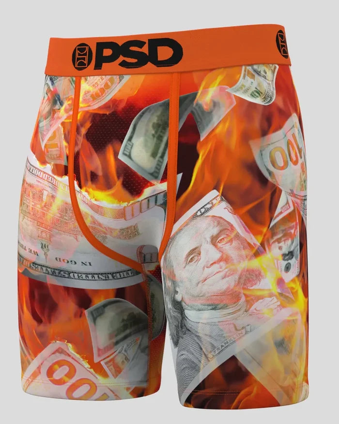 PSD Burning Benjis boxers in multi-color with bold dollar bill graphics, displayed on a neutral background.
