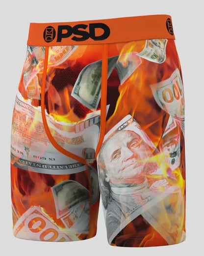 PSD Burning Benjis boxers in multi-color with bold dollar bill graphics, displayed on a neutral background.