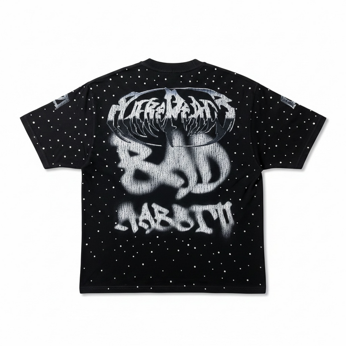 Black oversized T-shirt by Rare Peace with rhinestone embellishments and "Bad Habits" graphic, cropped style, casual streetwear look.