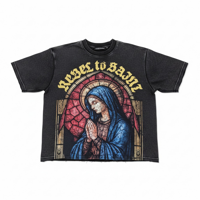 Black Rebel Minds 'Rebel to Saint' cropped T-shirt with graphic design, short sleeves, and relaxed fit, displayed on a plain background.