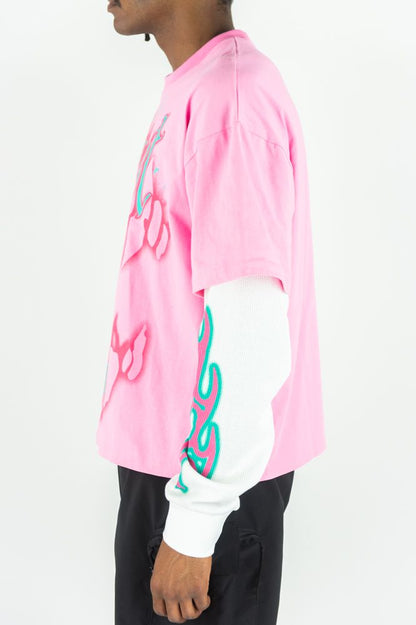 Pink Rebel Minds 'Trust No One' long-sleeve T-shirt with bold black text and logo print on front.