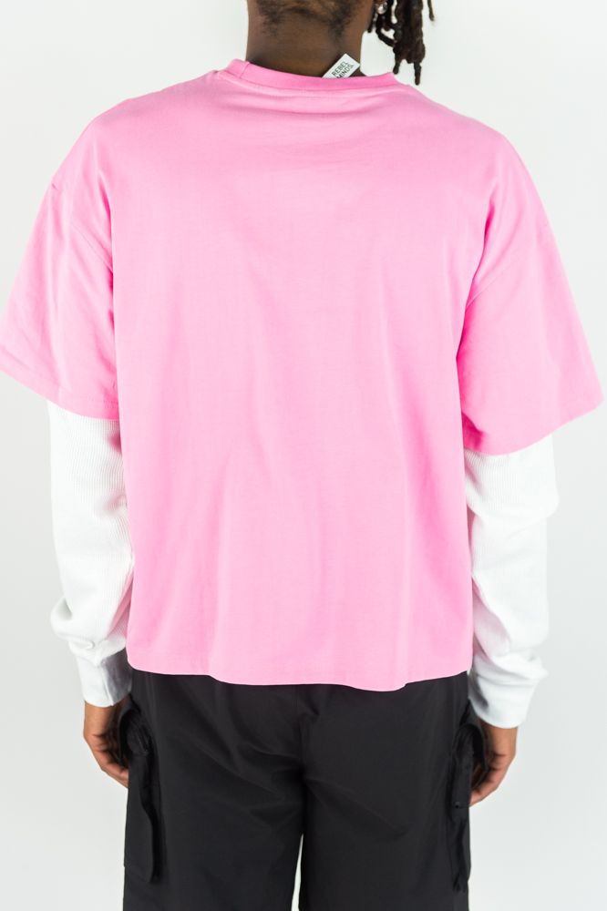 Pink Rebel Minds Trust No One long sleeve T-shirt featuring bold text design and casual fit, ideal for streetwear style.