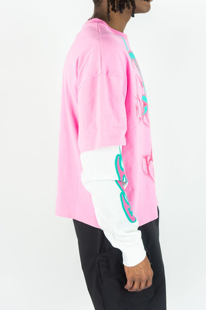 Pink Rebel Minds Trust No One long-sleeve T-shirt with bold black text on the front, casual fit, and comfortable fabric.
