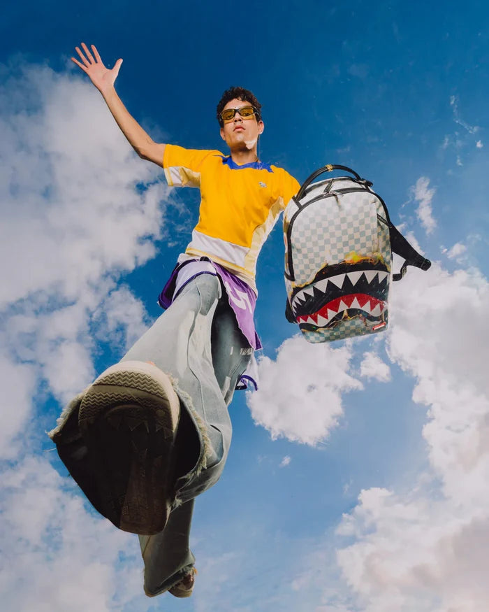 Sprayground Reveal The Real backpack in black with colorful graphic design, showing the stylish accessory with multiple compartments.